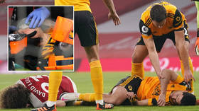 'We pray he's all right': Football star has operation on fractured skull after sickening collision horrifies brain injury experts