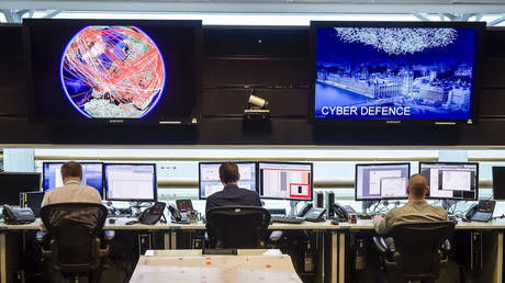 People sit at computers in the 24 hour Operations Room inside GCHQ, Cheltenham in Cheltenham, November 17, 2015.