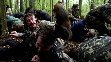 FILE PHOTO Participants take part in a practice hand-to-hand combat, during a military patriotic game of survival for youth, at the place of fighting between the Ukrainian Insurgent Army (UPA) and the Soviet NKVD secret police troops in April 1944, in Ternopil region, Ukraine, May 1, 2017