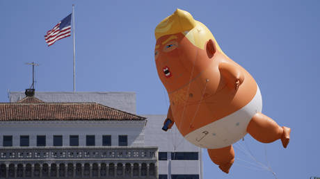 Protesters fly a giant Baby Trump balloon