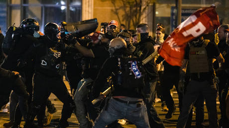 WATCH Trump supporters hit Antifa protesters with American flags during clashes in Washington state capital
