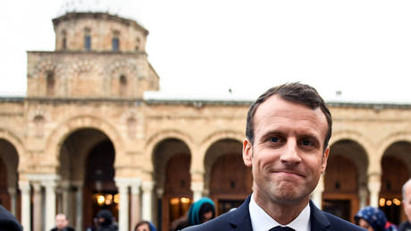 FILE PHOTO: Emmanuel Macron near the Zitouna mosque in the Medina (old town) in Tunis