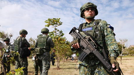 A soldier stands guard during 'Combat Readiness Week' drills in Hsinchu, Taiwan, October 29, 2020.
