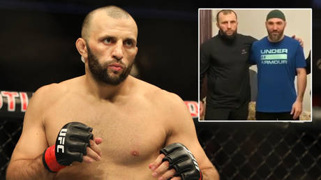 Calling a truce: Russian UFC fighter embraces man he reportedly hospitalized in boozy wedding fight after apologizing for fracas
