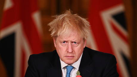 Boris Johnson reacts as he delivers a statement on the current statistics, testing and lockdown measures on November 5