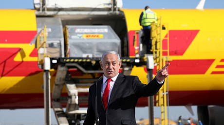 Israeli PM Benjamin Netanyahu welcomes the first batch of Pfizer/BioNTech Covid-19 vaccine at Ben Gurion Airport near Tel Aviv, Israel, December 9, 2020
