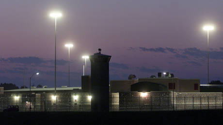 FILE PHOTO: The sun sets on the Federal Corrections Complex in Terre Haute, Indiana, where death row inmate Brandon Bernard was held.