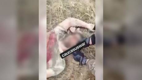 Armenian soldier cuts ear off Azerbaijani enemy in shocking clip amid claims Yerevan behind war crimes in Nagorno-Karabakh (VIDEO)