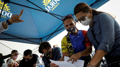Venezuela&rsquo;s Guaido-led opposition holds alternative vote and then BURNS BALLOTS after boycotting legislative elections