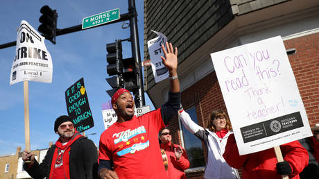 Chicago teachers are shown during a strike last year that shut down schools for 11 days and led to higher pay and other concessions. This time around, many teachers plan to stay home when schools reopen in January because of Covid-19 fears.