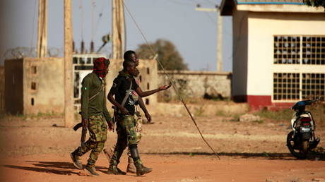 Nigerian soldiers are seen at the Government Science school in Kankara, Nigeria, where more than 300 students were kidnapped last week, December 13, 2020.