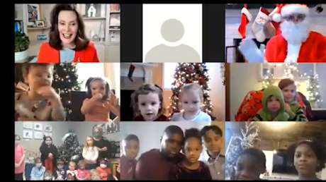 A screenshot shows Michigan Governor Gretchen Whitmer's Zoom call with children and Santa Claus.