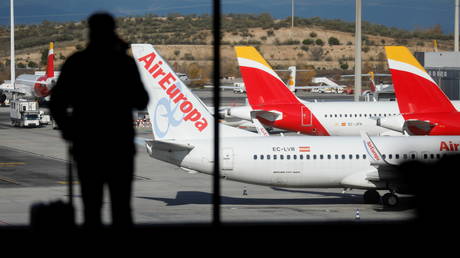 Iberia and Air Europa airplanes are parked at a tarmack at Adolfo Suarez Barajas airport in Madrid, Spain, December 15, 2020.