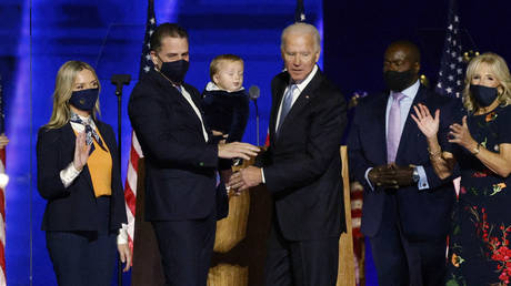 Joe and Hunter Biden, along with other family members, celebrate onstage after the news media announced that Biden won the 2020 presidential election, November 7, 2020 © Reuters / Jim Bourg