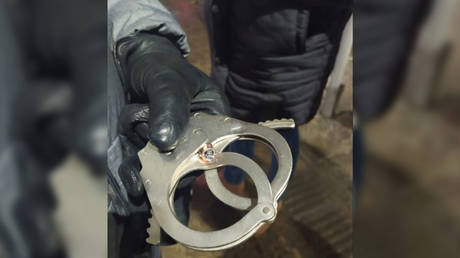 Cuff luck! Russian Police officer dodges death when drug dealer opens fire, with bullet lodging in cop&rsquo;s handcuffs (VIDEO)