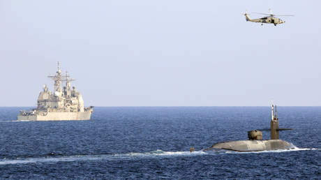 USS Georgia transits the Strait of Hormuz accompanied by guided-missile cruiser USS Port Royal, December 21, 2020.