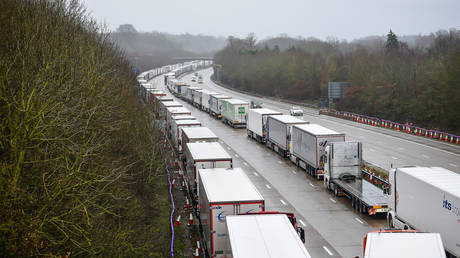 Lorries queue on the M20 motorway, Kent, UK, December 21, 2020.