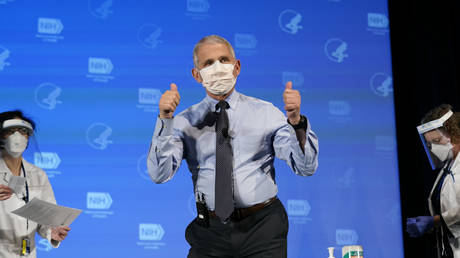 Dr. Anthony Fauci, director of the National Institute of Allergy and Infectious Diseases, gives the thumbs up after receiving his first dose of the COVID-19 vaccine at the National Institutes of Health on December 22, 2020 in Bethesda, Maryland.