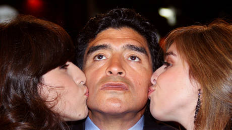 Maradona pictured with daughters Giannina and Dalma in 2008. © AFP