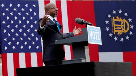 Georgia Senate candidate Raphael Warnock is shown campaigning in Atlanta earlier this month.