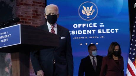 U.S. President-elect Joe Biden enters the room followed by Vice President- elect Kamala Harris and their nominee for secretary of education, Miguel Cardona in Wilmington, Delaware, U.S., December 23, 2020.