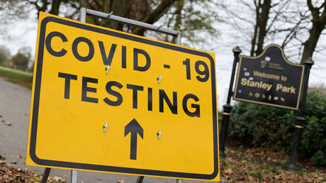 FILE PHOTO: A sign is seen at a coronavirus test centre at Stanley Park, near Anfield, Liverpool, Britain, November 5, 2020 © Reuters / Carl Recine