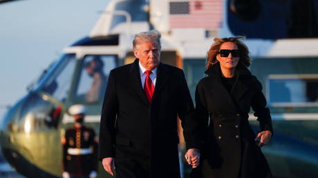 President Donald Trump and first lady Melania Trump prepare to board Air Force One, December 23, 2020.