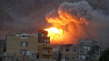 FILE PHOTO: Fire and smoke billow from an army weapons depot after it was hit by a Saudi air strike in Yemen's capital, Sanaa.