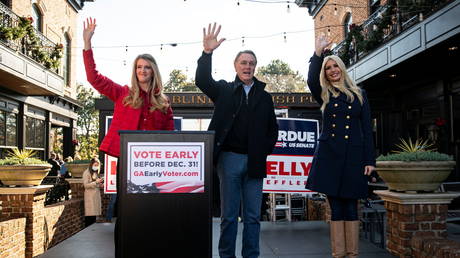 Senator David Perdue (center) campaigns with fellow Republican Kelly Loeffler and White House senior advisor Ivanka Trump in Milton, Georgia, December 21, 2020.
