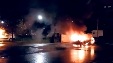 Cars are seen burning following a spree of arson across Strasbourg, France amid chaotic New Year's Eve celebrations, December 31, 2020.