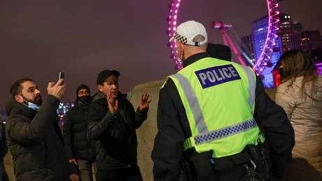 Police tell people to go home during an anti-lockdown protest in London, Britain December 31, 2020.