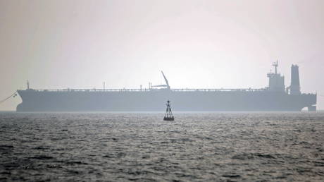 FILE PHOTO: An oil tanker loads gas in Assaluyeh seaport in the Persian Gulf, 870 miles (1,400km) south of Tehran, Iran.