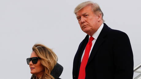 U.S. President Donald Trump and first lady Melania Trump descend from Air Force One at Joint Base Andrews in Maryland, US, December 31, 2020.