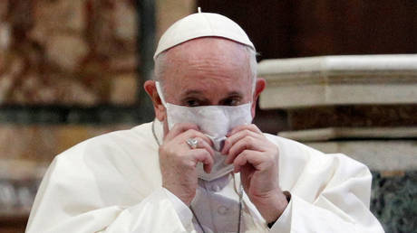 FILE PHOTO: Pope Francis wearing a face mask attends an inter-religious prayer service in Rome, Italy, Oct. 20, 2020. © REUTERS/Guglielmo Mangiapane