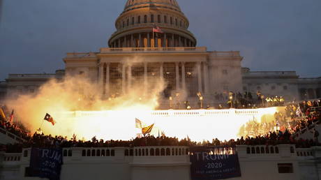 An explosion caused by a police munition is seen while supporters of U.S. President Donald Trump gather in front of the US Capitol Building in Washington, US, January 6, 2021