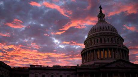 The sun sets on the US Capitol (FILE PHOTO) - and on the American Empire.