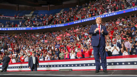 FILE PHOTO: President Donald Trump speaks to a crowd onstage at his first re-election campaign rally at the BOK Center in Tulsa, Oklahoma, June 20, 2020.