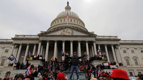 Donald Trump's supporters climb on walls at the US Capitol in Washington, DC, January 6, 2021 © Reuters / Jim Bourg