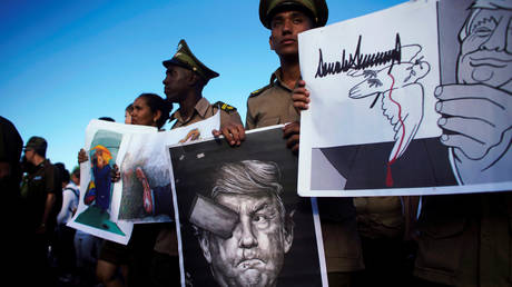 FILE PHOTO: Cuban soldiers carry images depicting US President Donald Trump during a May Day rally in Havana, Cuba.