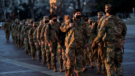 National Guard troops arrive at the US Capitol in the wake of a riot at the building last week, in Washington, DC, January 12, 2021.