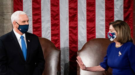 FILE PHOTO: US House Speaker Nancy Pelosi and Vice President Mike Pence preside over the joint session of Congress to certify the 2020 election results on Capitol Hill in Washington, DC, January 6, 2021.