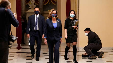 U.S. House Speaker Nancy Pelosi (D-CA) walks outside the House chamber as the House prepares to vote on a resolution demanding Vice President Pence and the cabinet remove President Trump from office, at the U.S. Capitol in Washington, U.S., January 12, 2021. © REUTERS/Erin Scott