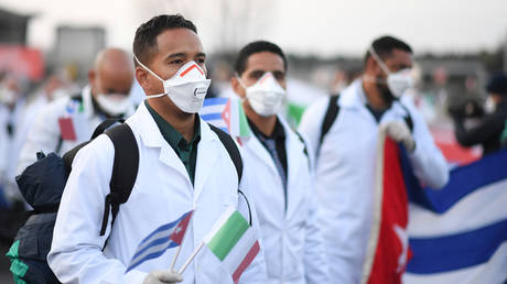 FILE PHOTO: An emergency contingent of Cuban doctors and nurses arrive at Italy's Malpensa airport after travelling from Cuba to help Italy battle the spread of coronavirus disease (COVID-19), near Milan, Italy, March 22, 2020