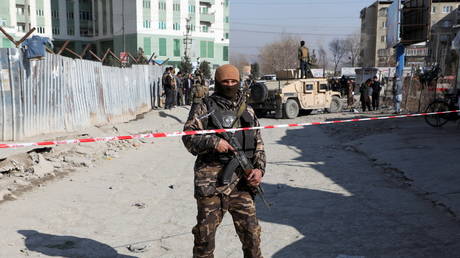 FILE PHOTO: An Afghan security officer stands guard in Kabul, Afghanistan December 15, 2020.