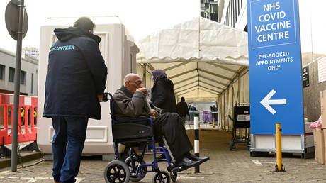 Recipients of the covid vaccine arrive at the Olympic Office Centre, one of 10 new mass vaccination centres on January 18, 2021 in Wembley, England