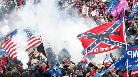 FILE PHOTO: Tear gas is released into a crowd of protesters during clashes with Capitol police at a rally to contest the certification of the 2020 US presidential election results by the US Congress, at the US Capitol Building in Washington, U.S, January 6, 2021