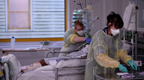 Nurses treat Covid-19 patients in Intensive Care Unit in Britain, January 20, 2021
