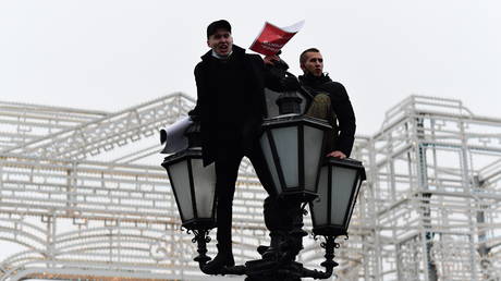 Supporters of jailed Russian opposition activist Alexei Navalny take part in a rally to support him, in Moscow, Russia.