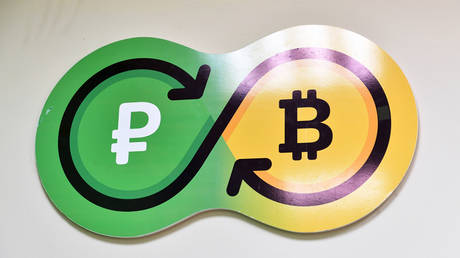 FILE PHOTO: The logo of the Sbercoin crytocurrency exchange office in Moscow © Sputnik / Vladimir Pesnya