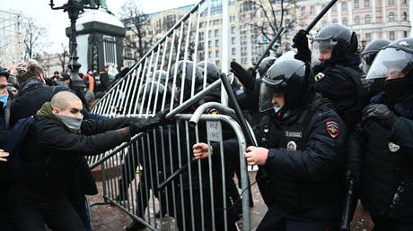 Participants of an unauthorized rally of supporters of Alexei Navalny and police officers on Pushkin Square in Moscow.